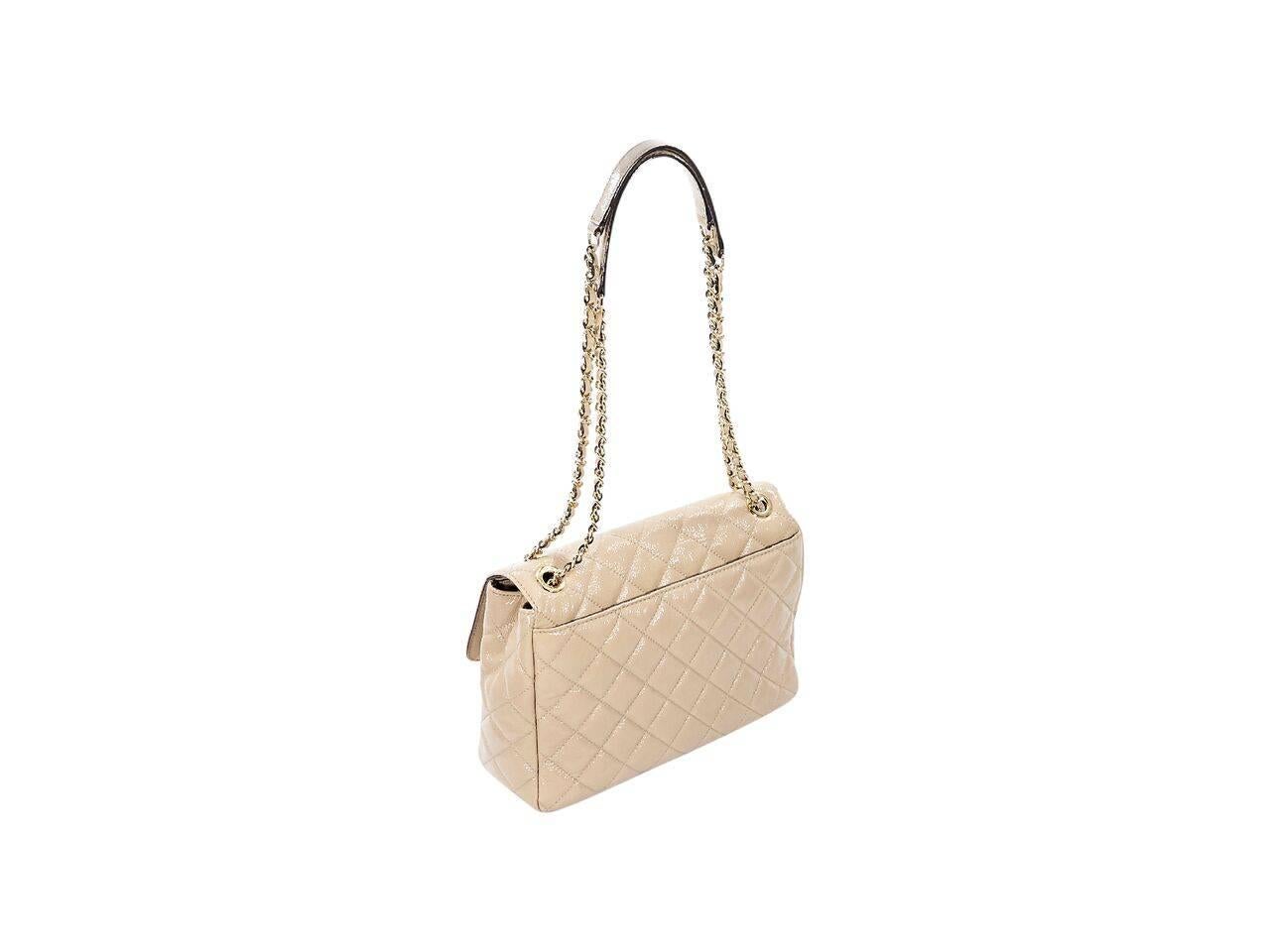 Product details:  Nude quilted patent leather Sloan shoulder bag by Michael Kors.  Dual chain and leather shoulder straps.  Front flap with push-lock closure.  Lined interior with inner zip compartment plus inner zip and slide pockets.  Goldtone