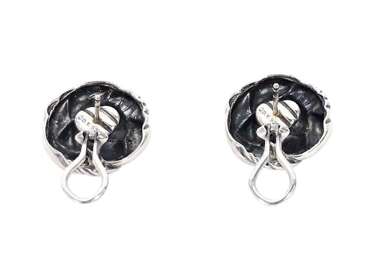 Product details:  Round silver knot earrings by David Yurman.  Post and clip back closure.  
Condition: Pre-owned. Very good.
Est. Retail $ 850.00