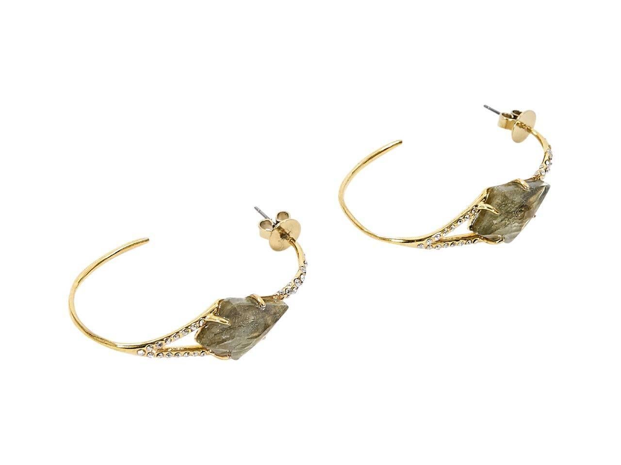 Product details:  Goldtone hoop earrings by Alexis Bittar.  Embellished with crystals and a faceted stone.  Post closure.  
Condition: Pre-owned. Very good.
Est. Retail $ 398.00