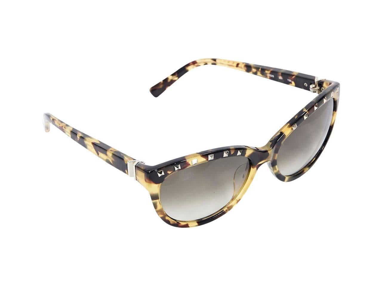 Product details:  Tortoiseshell sunglasses by Valentino.  Accented with pyramid studs.  Gradient lenses.  Goldtone hardware.
Condition: Pre-owned. Very good.
Est. Retail $ 398.00
