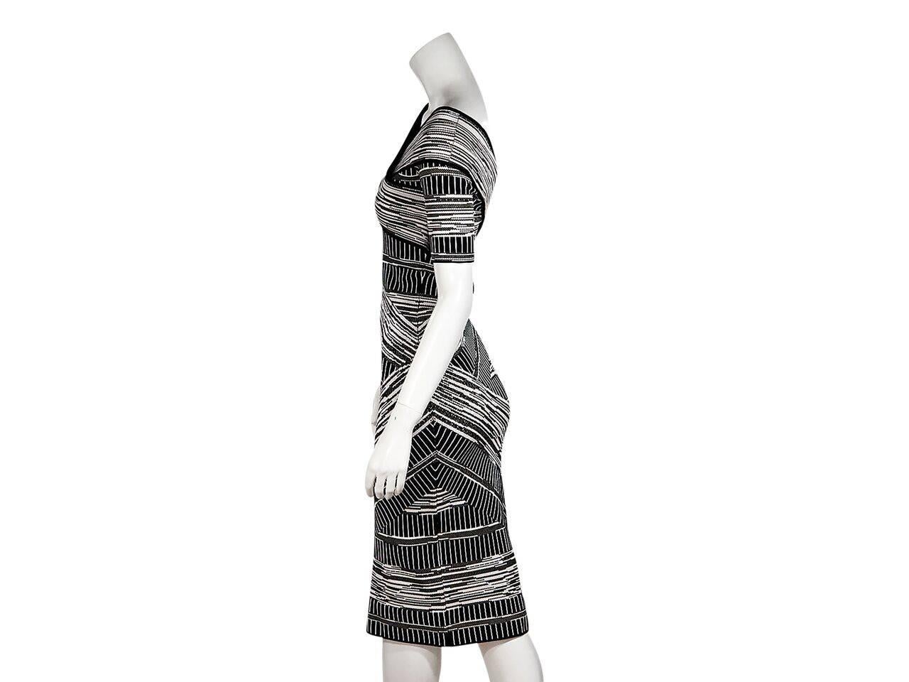 Product details:  Black and white bandage dress by Christian Siriano.  Wide boatneck.  Short sleeves.  Pullover style.  
Condition: Pre-owned. New with tags.
Est. Retail $ 1,500.00