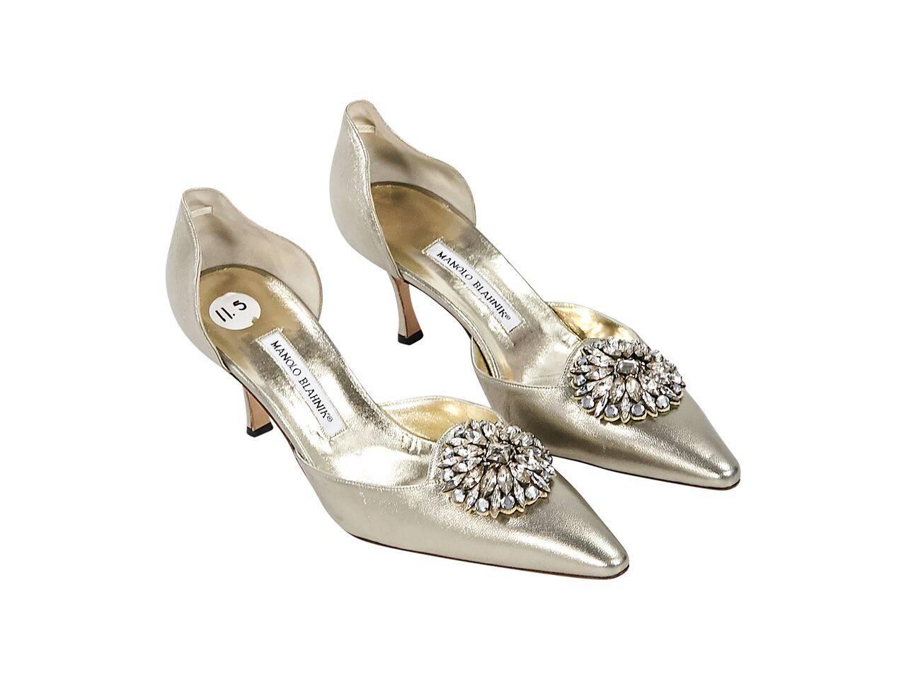 Product details:  Metallic gold leather d'Orsay pumps by Manolo Blahnik.  Crystal embellishment at vamp.  Point toe.  Slip-on style. 
Condition: Pre-owned. Very good.
Est. Retail $ 945.00