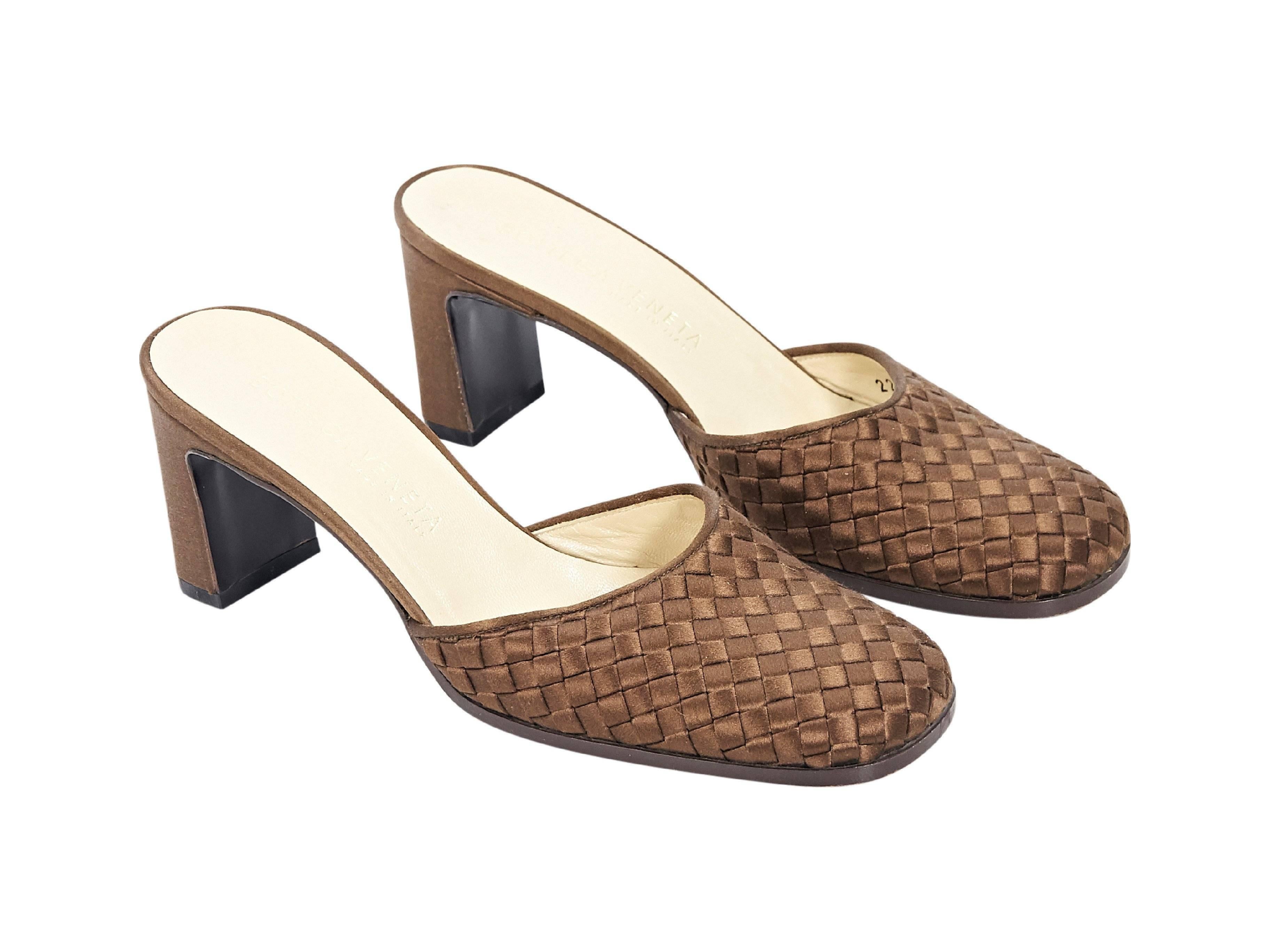 Product details:  Brown woven satin mules by Bottega Veneta.  Round square toe.  Slip-on style. 2.5