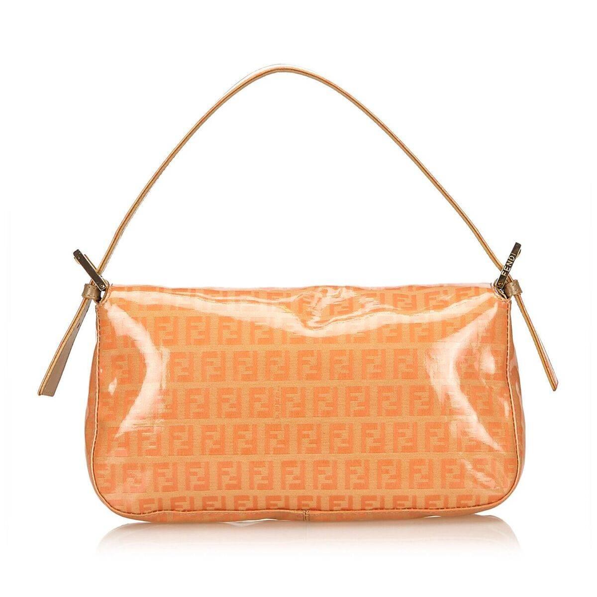 Product details:  Orange coated canvas Zucchino Mama baguette bag by Fendi.  Single shoulder strap.  Front flap with magnetic snap closure.  Lined interior with inner zip pocket.  Silvertone hardware.  Dust bag included.  10 6 2 
Condition: