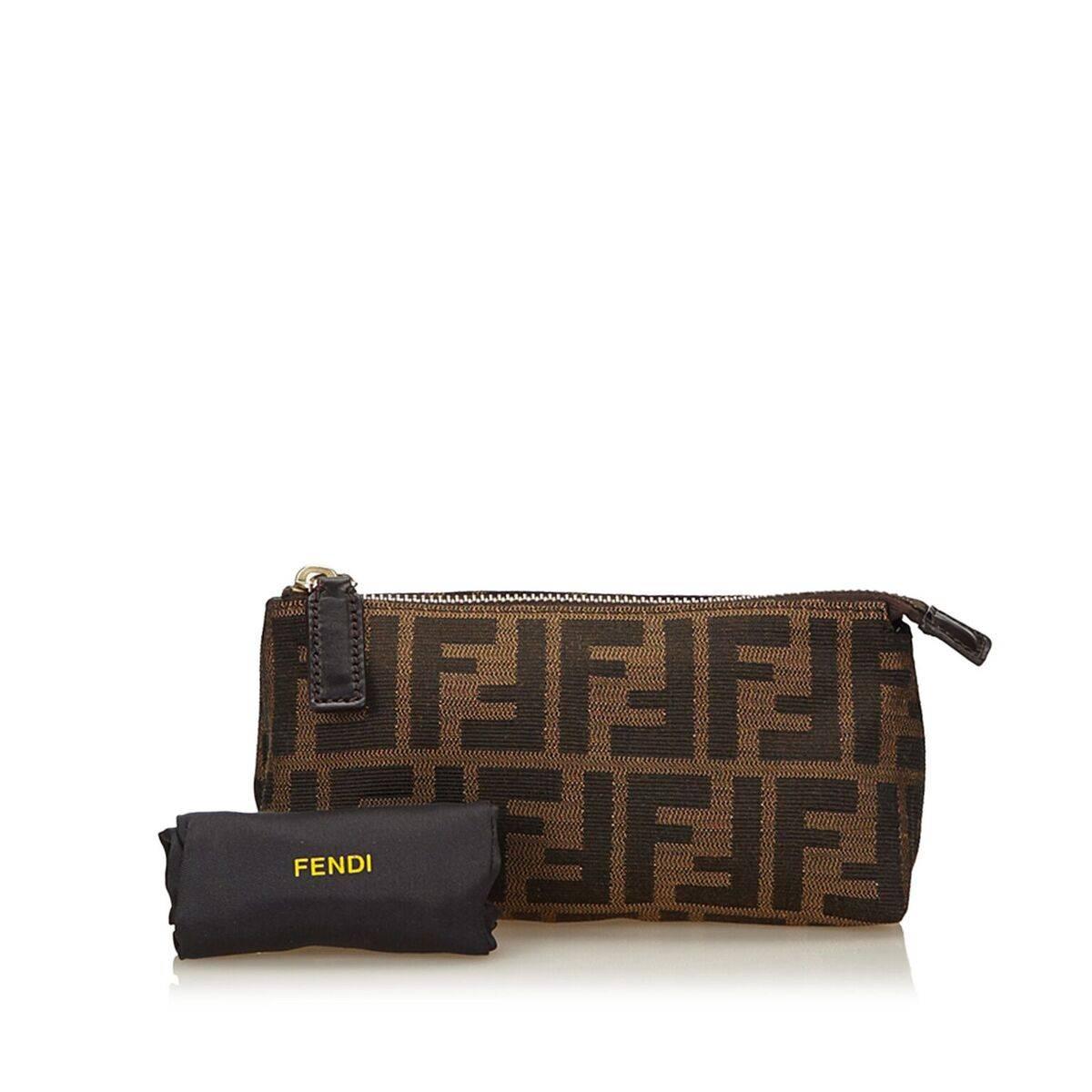 Product details:  Brown Zucca jacquard pouch by Fendi.  Top zip closure.  Lined interior.  Goldtone hardware.  Dust bag included.  7