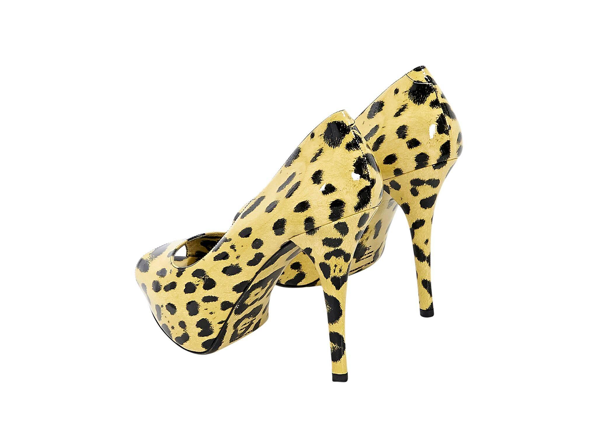 Product details:  Yellow and black leopard-print patent leather pumps by Dolce & Gabbana.  Peep toe.  Platform design.  Slip-on style. 
Condition: Pre-owned. Very good.
Est. Retail $598