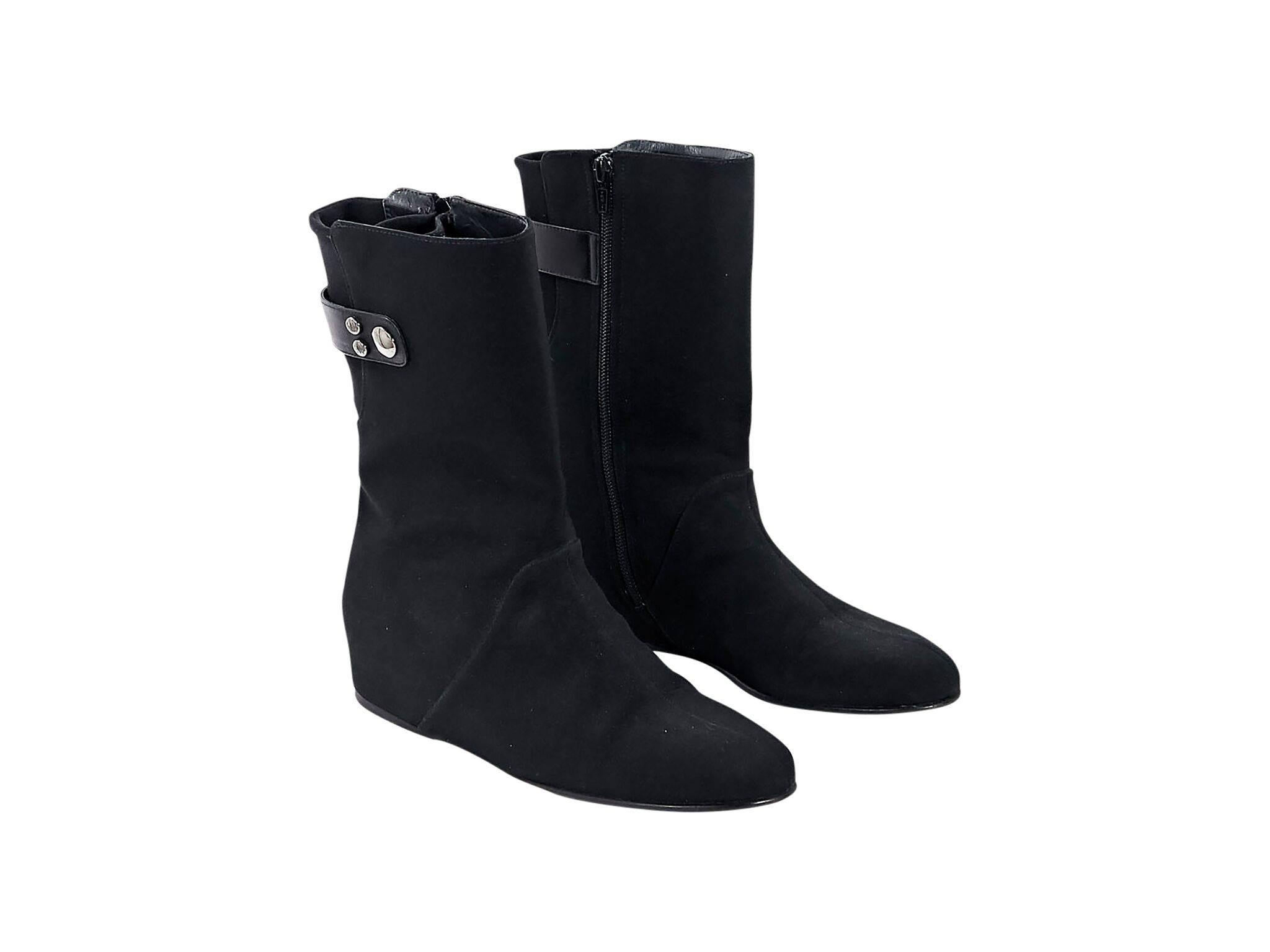 Product details:  Black wedge ankle boots by Stuart Weitzman.  Shaft strap accent.  Round toe.  Inner zip closure.  
Condition: Pre-owned. Very good.
Est. Retail $398

