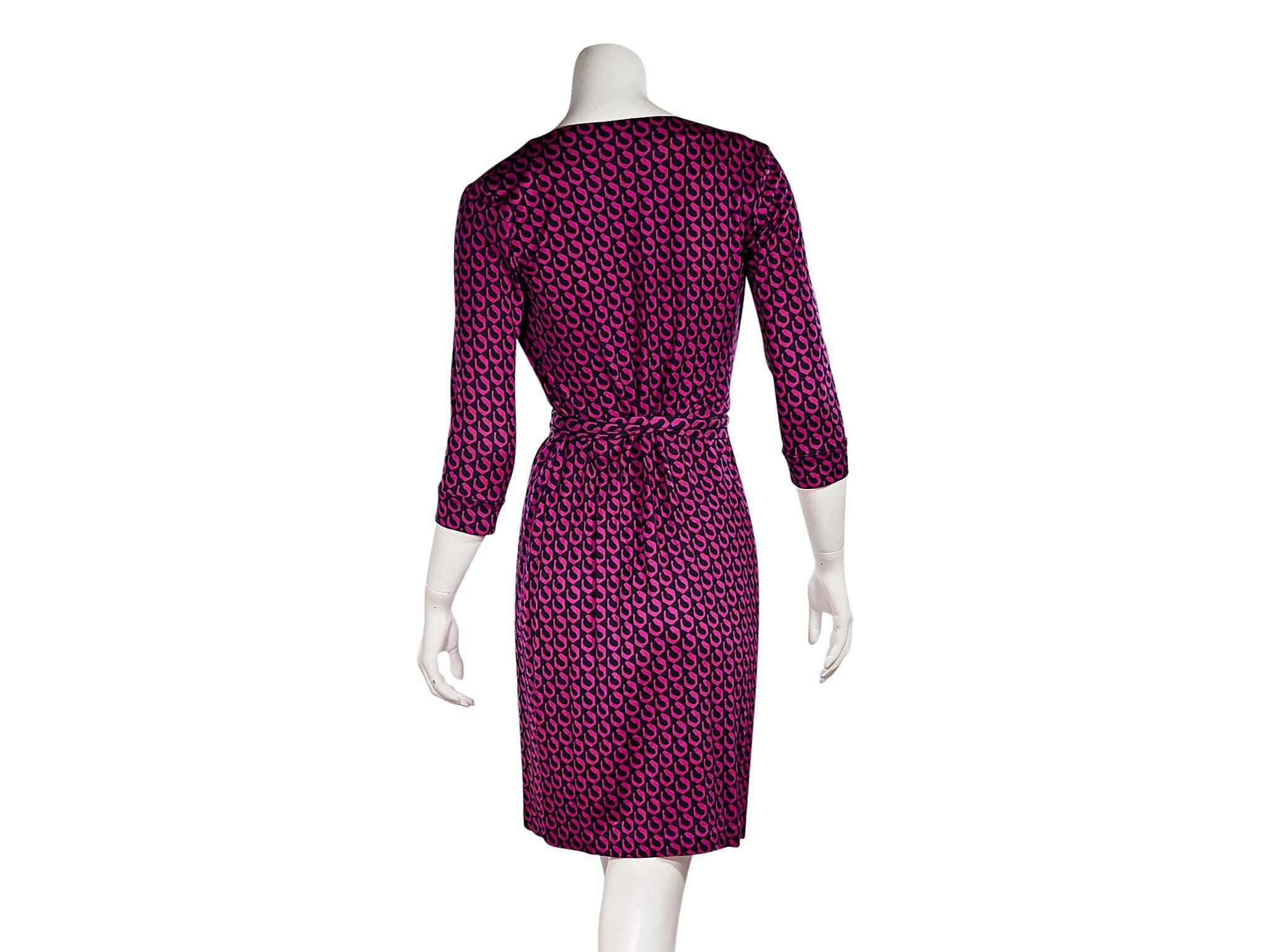 Product details:  Pink geometric-printed silk wrap dress by Diane von Furstenberg.  Deep v-neck.  Elbow-length sleeves.  Self-tie waist.  
Condition: Pre-owned. Very good.
Est. Retail $398