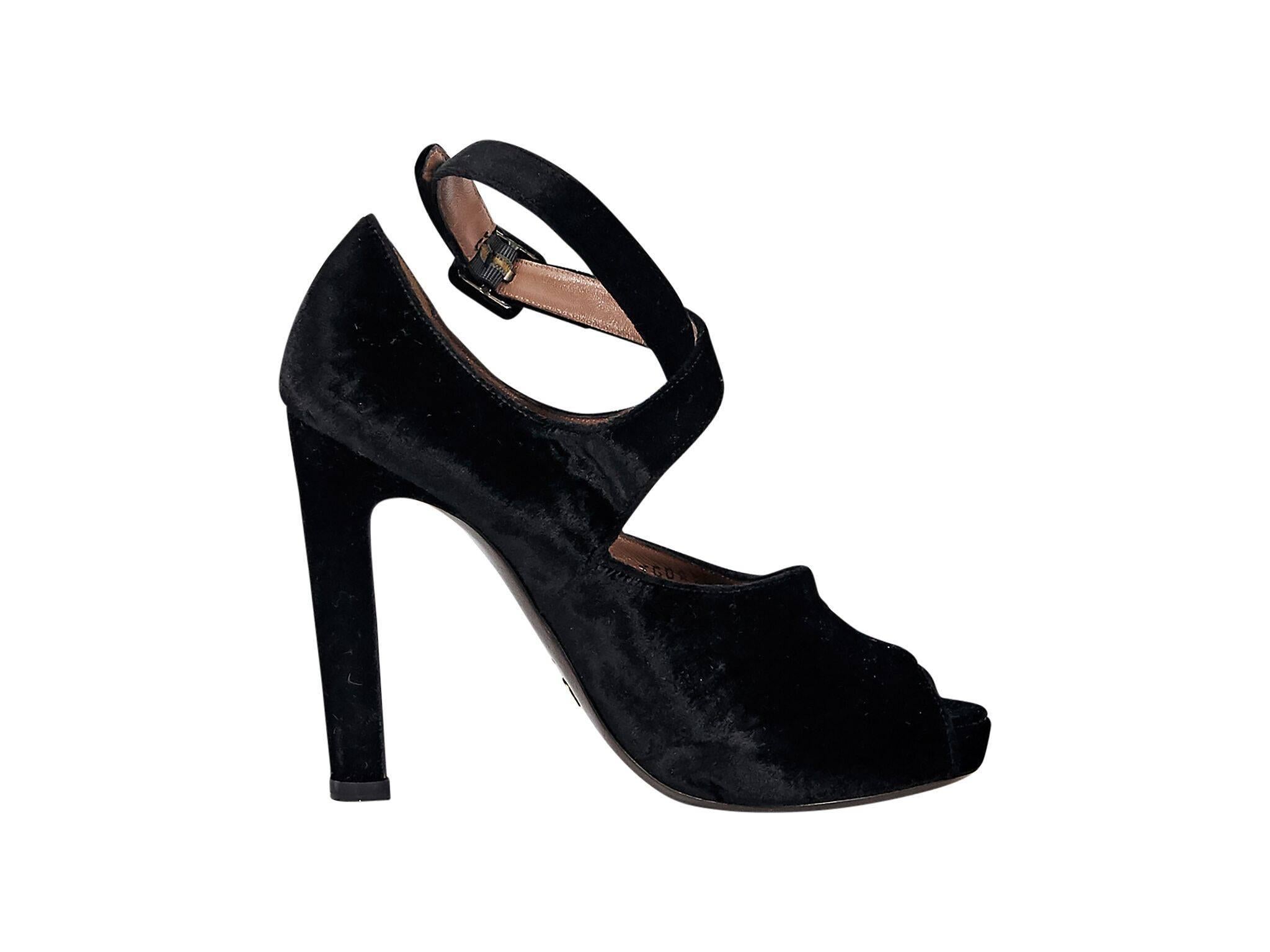 Product details:  Black velvet platform pumps by Giorgio Armani.  Adjustable ankle strap.  Peep toe.  
Condition: Pre-owned. Very good.
Est. Retail $585