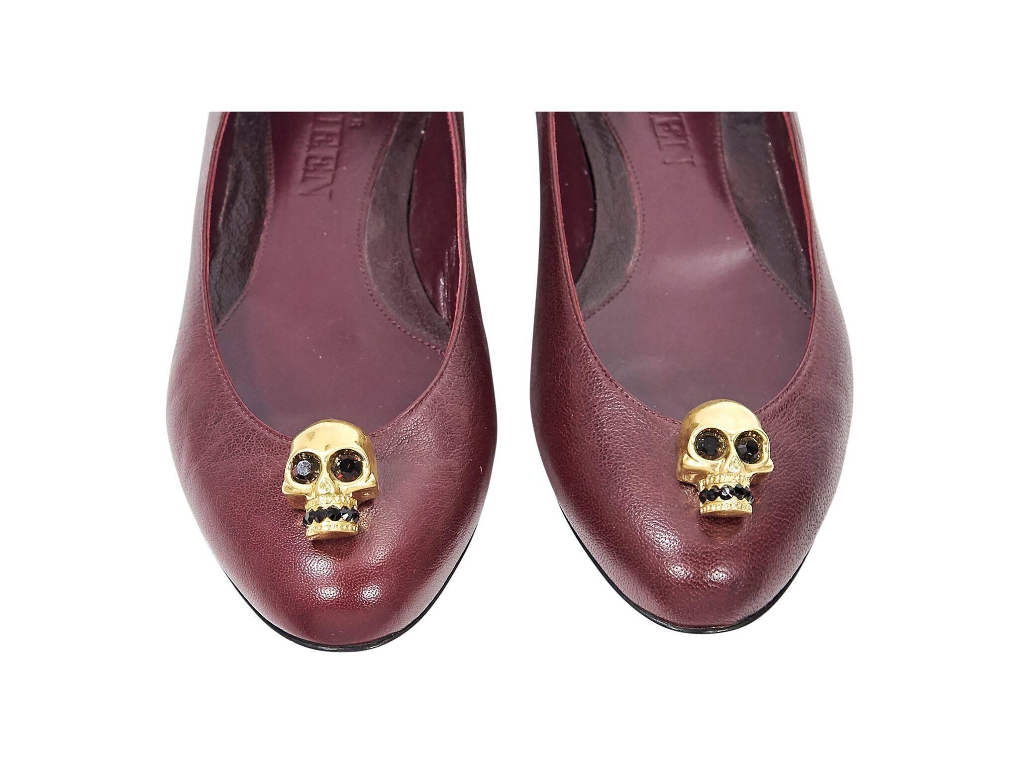 Product details:  Red leather ballet flats by Alexander McQueen.  Goldtone logo skull detail.  Round toe.  Slip-on style.
Condition: Pre-owned. Very good.
Est. Retail $738