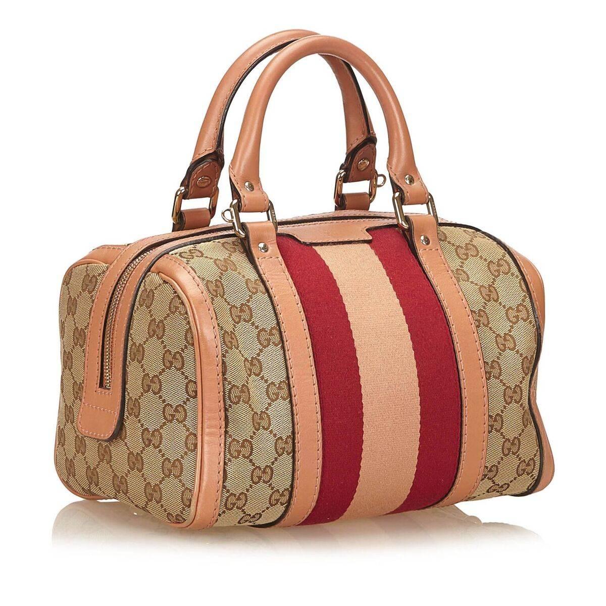 Product details:  Multicolor jacquard Guccissima satchel by Gucci.  Trimmed with leather.  Dual carry handles.  Detachable, adjustable crossbody strap.  Top zip closure.  Interior zip pocket.  Silvertone hardware.  10
