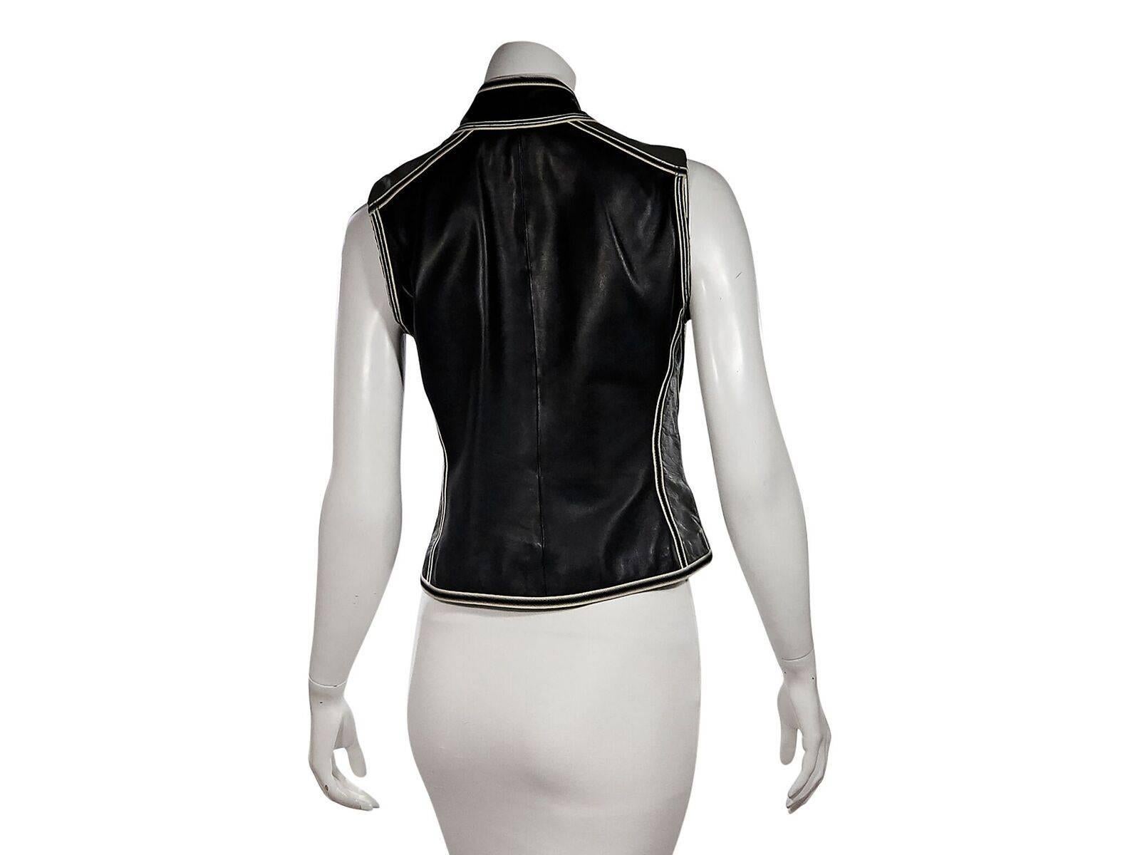 Product details:  Black leather vest by Giorgio Armani.  Accented with white topstitching.  Stand collar. Sleeveless.  Concealed zip-front closure.  36