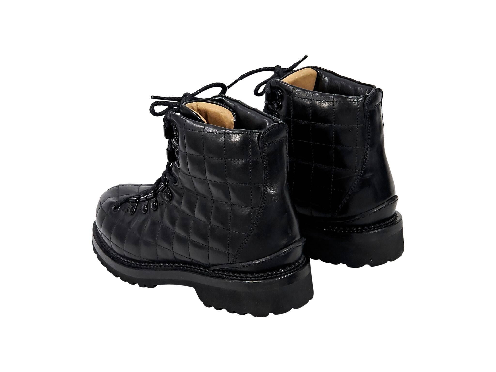 Product details:  Black quilted leather combat ankle boots by Buttero.  Round toe.  Lace-up closure.  
Condition: Pre-owned. Very good.
Est. Retail $595