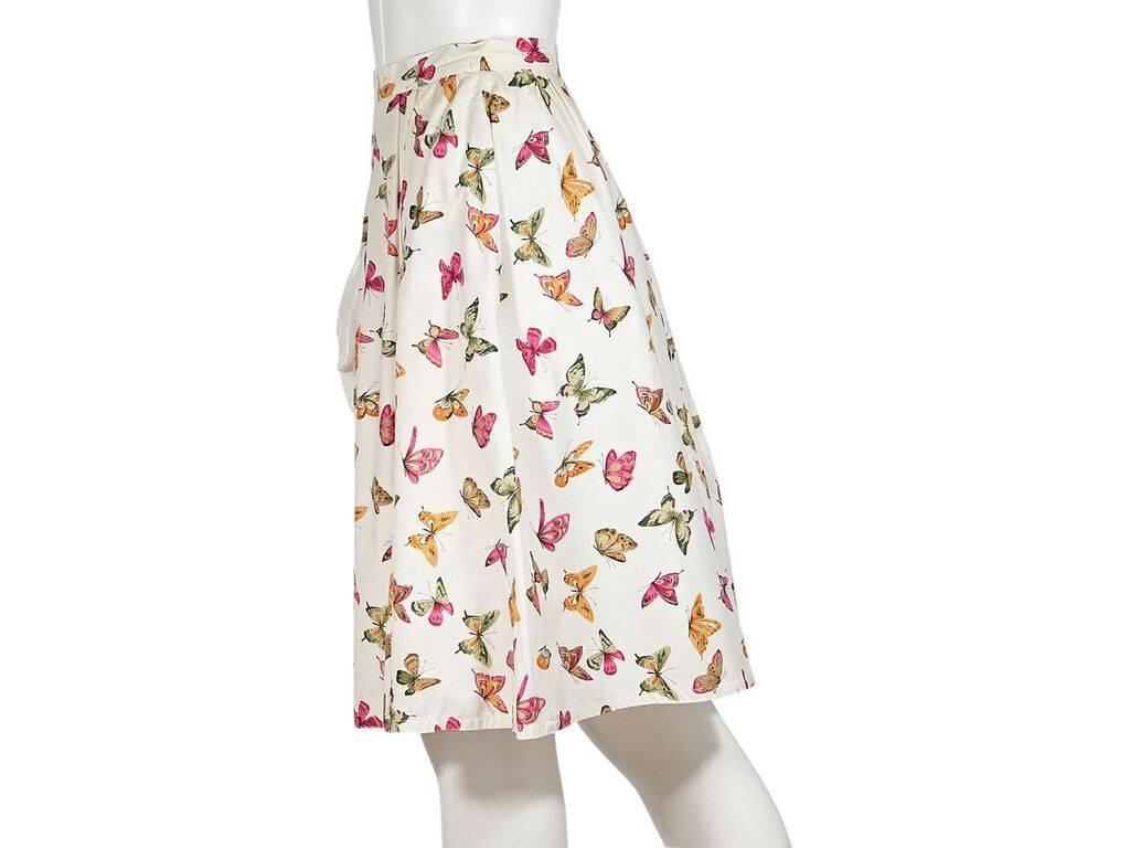 Product details:  Vintage multicolor butterfly-printed skirt by Gucci.  A-line silhouette.  Banded waist.  Button and zip back closure.  Label size IT 42.  26
