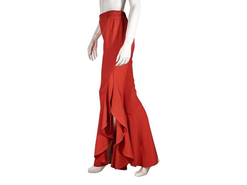 Product details:  Red-orange high-rise flared pants by Jonathan Simkhai x Carbon38.  Elasticized waist.  Cascading flared ruffles.  Side slits.  Pull-on style.  28