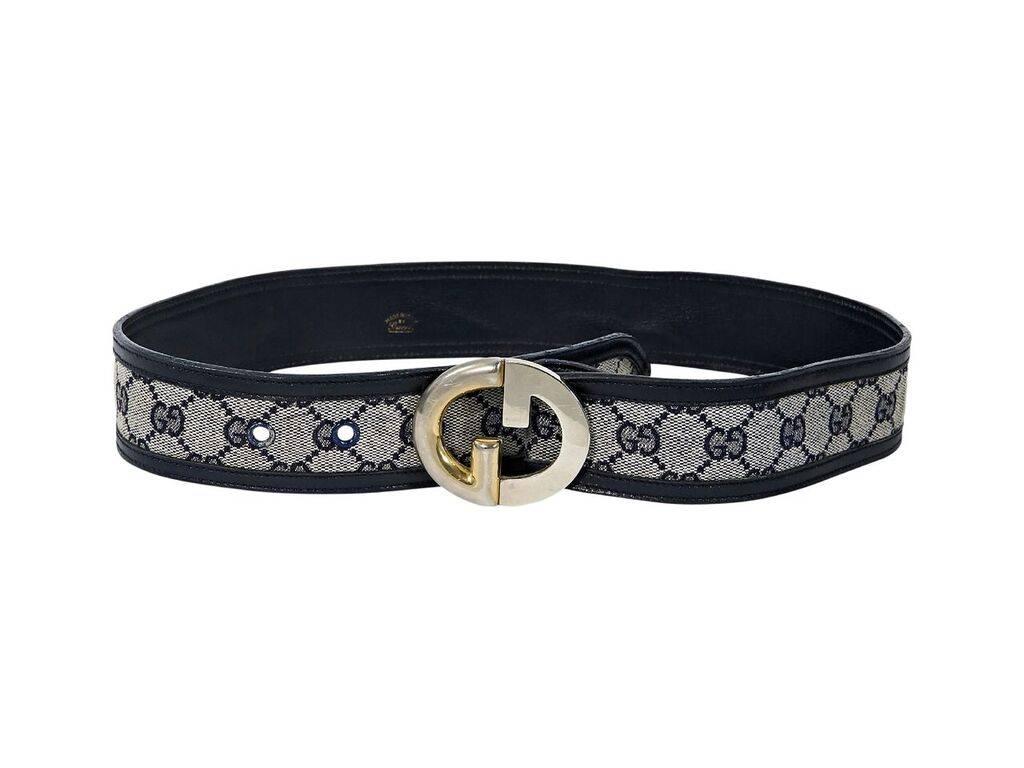 Product details:  Vintage navy blue monogram belt by Gucci.  Adjustable buckle closure.  Goldtone hardware.  28
