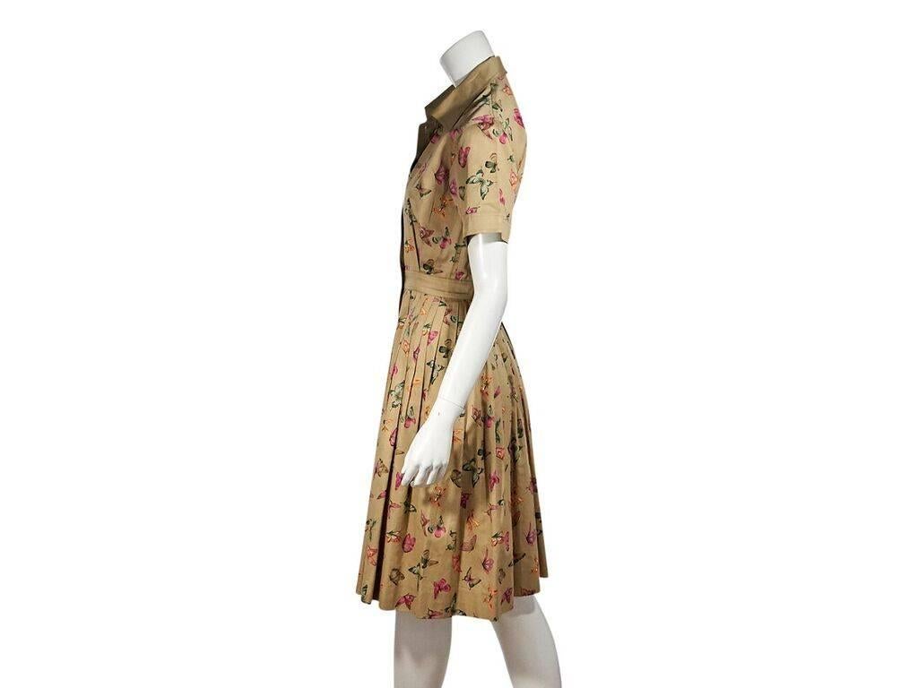 Product details:  Vintage multicolor butterfly-printed cotton shirtdress by Gucci.  Spread collar.  Short sleeves.  Button-front closures.  Banded waist.  Pleated skirting.  36
