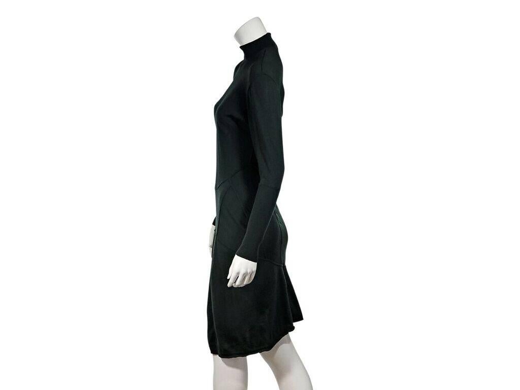 Product details:  Forest green wool sweater dress by Alaia.  Mock neck.  Long sleeves.  Back button closure.  34