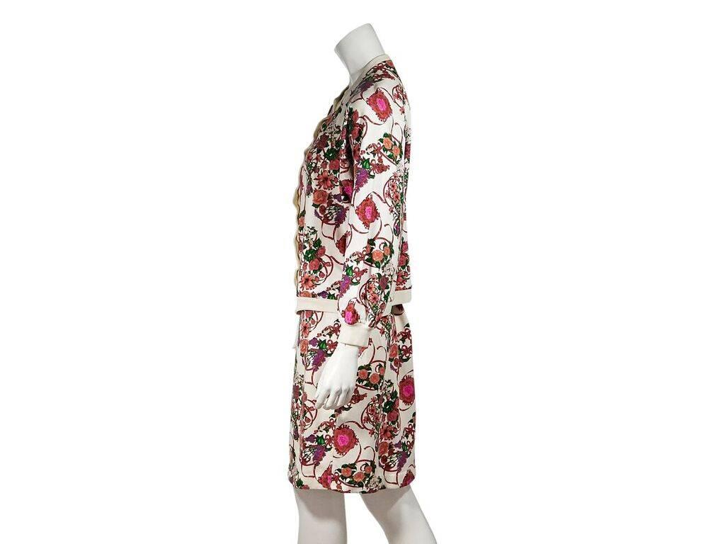 Product details:  Vintage multicolor floral-printed cotton skirt set by Hermes.  Crewneck.  Long sleeves.  Snap-front closure.  Matching pencil skirt.  Elasticized waist.  Pull-on style.  Jacket:  46