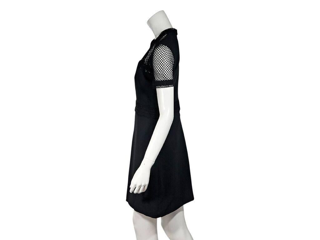 Product details:  Black mesh-bodice sheath dress by Elie Saab.  Jewelneck.  Short sleeves.  Banded waist.  Concealed back zip closure.  36
