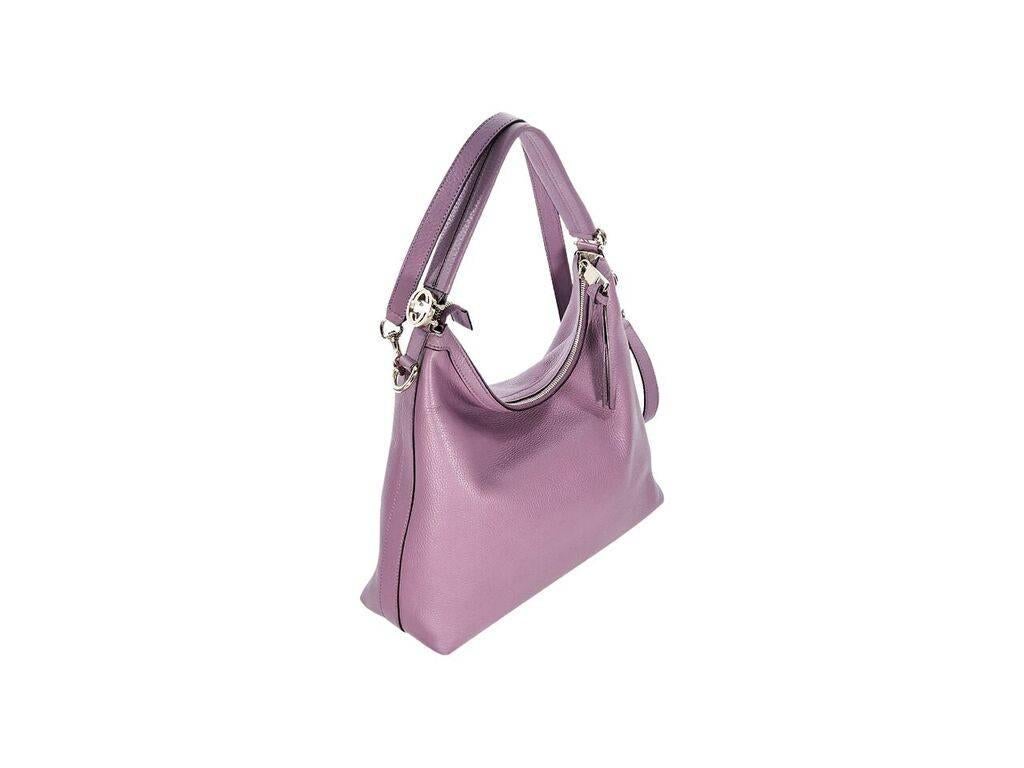 Product details:  Purple leather Miss GG shoulder bag by Gucci.  Single shoulder strap.  Detachable crossbody strap.  Top zip closure.  Lined interior with inner zip and slide pockets.  Goldtone hardware.  13