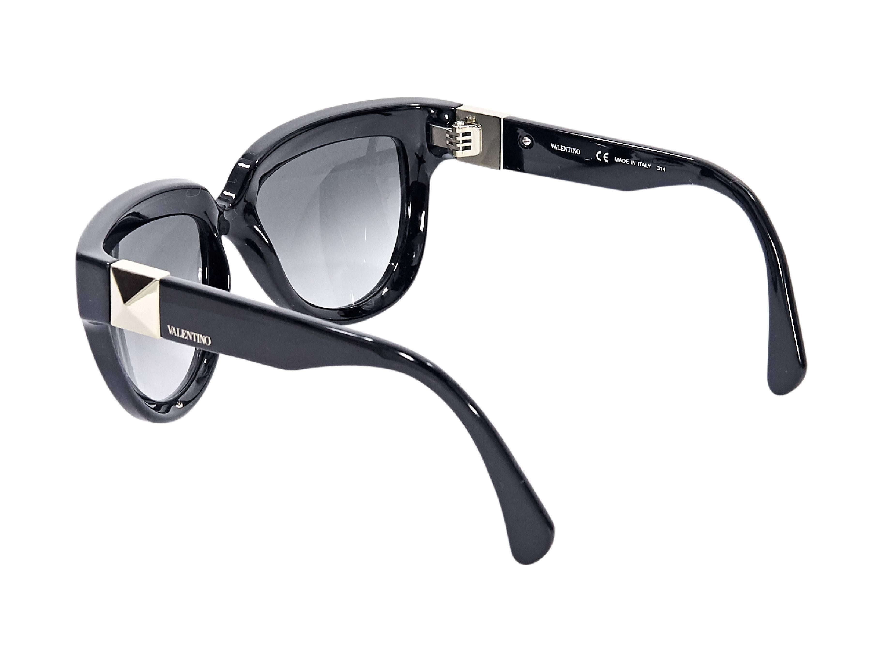 Product details:  Black sunglasses by Valentino.  Gradient lenses.  Pyramid stud at temples.  Case included.  2