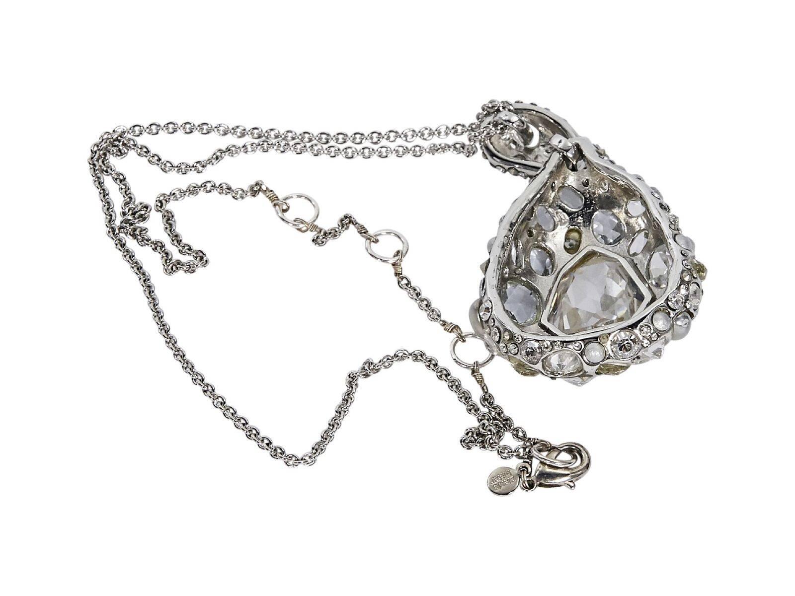 Product details:  Silvertone crystal-set teardrop pendant necklace by Alexis Bittar.  Adjustable lobster clasp closure.  19