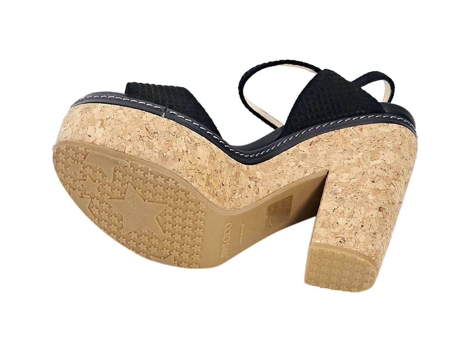 Product details:  Black suede platform sandals by Jimmy Choo.  Adjustable ankle strap.  Open toe.  Chunky cork heel and platform.  EU size 41.  5