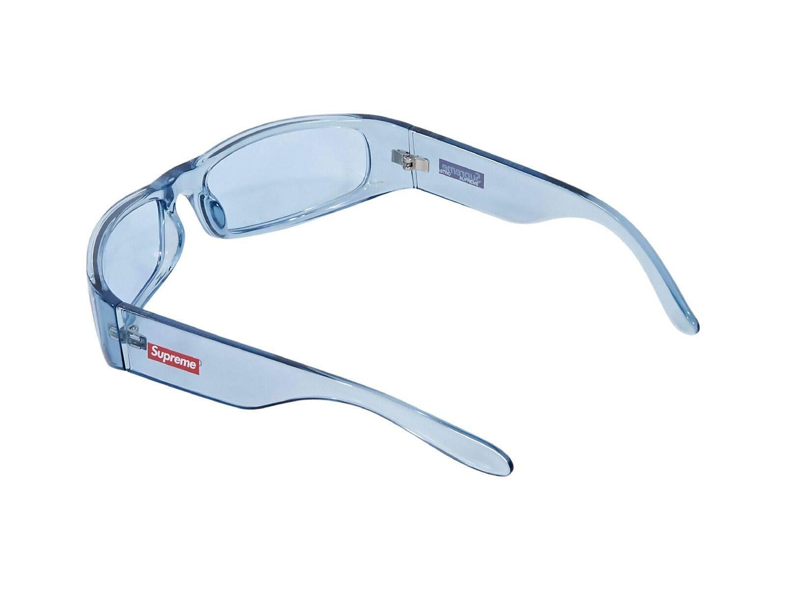 Product details:  Light blue Astro sunglasses by Supreme.  Case included.  2.5