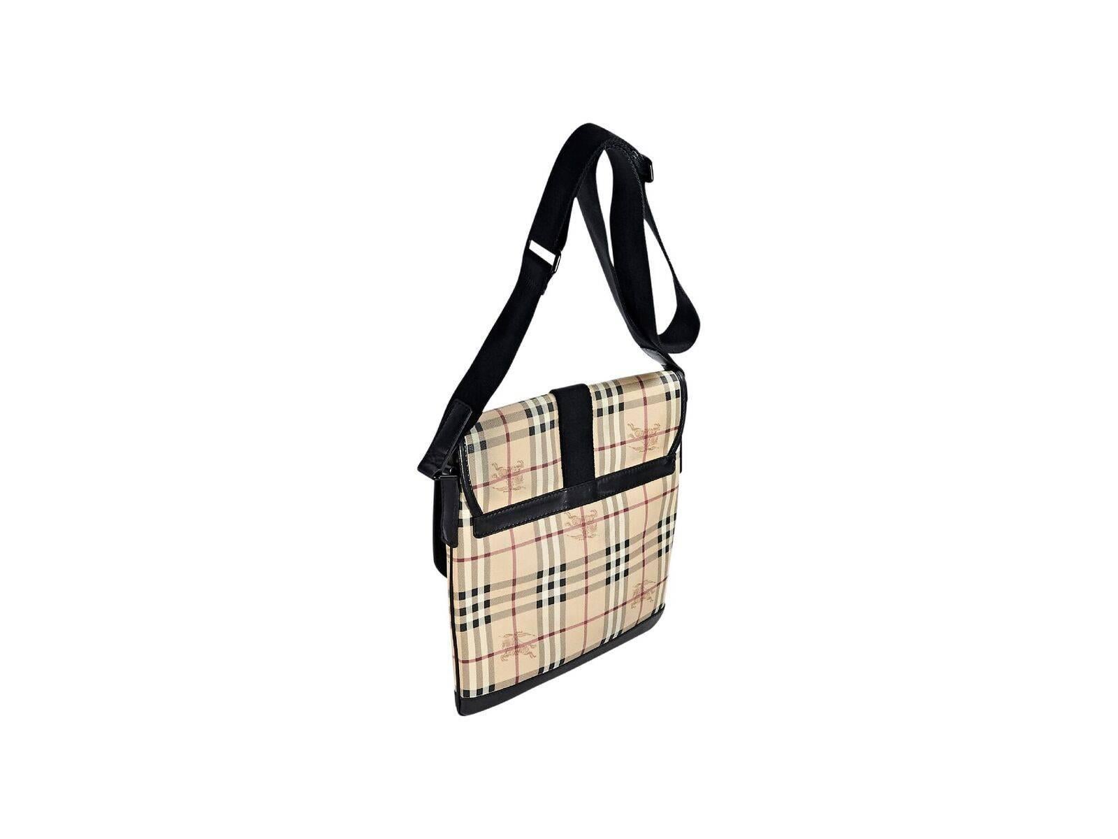 Product details:  Multicolor haymarket check messenger bag by Burberry.  Adjustable crossbody strap.  Front flap with buckle closure.  Lined interior with inner zip and slide pockets.  Black hardware.  12.25