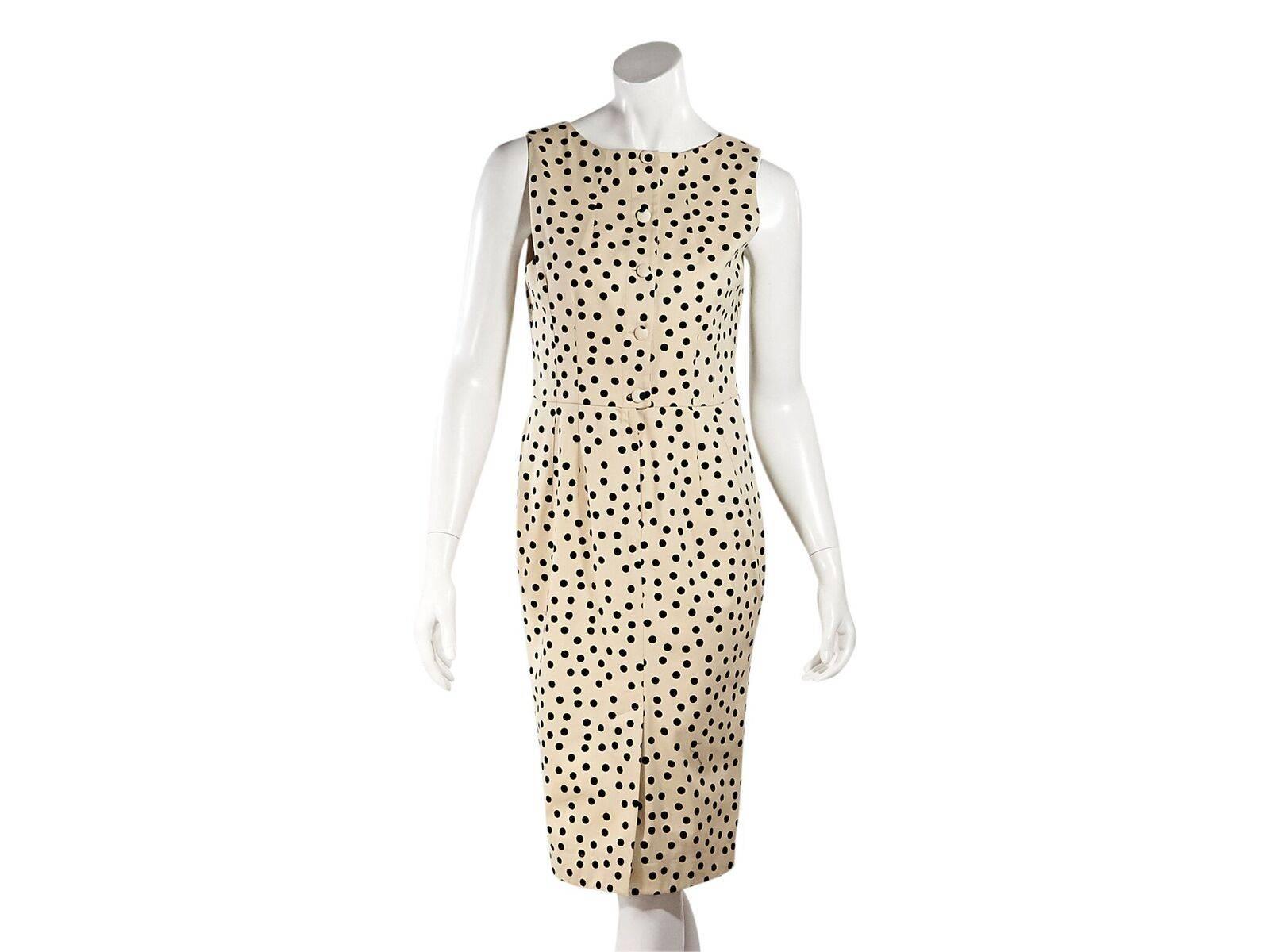 Product details:  Tan and black polka-dot sheath dress by Dolce & Gabbana.  Boatneck.  Sleeveless.  Button and concealed zip front closure.  Front hem vent.  Label size IT 46.  34