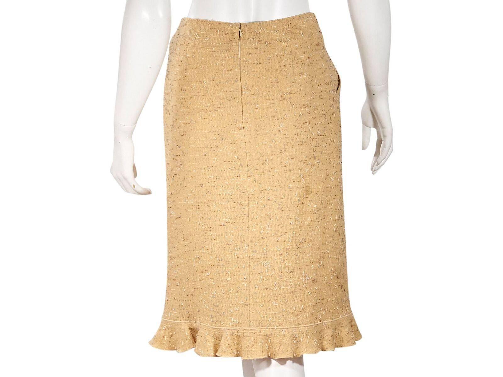 Product details:  Yellow tweed pencil skirt by Chanel.  Banded waist.  Waist slide pockets.  Concealed back zip closure.  Ruffle hem.  Label size FR 36.  27