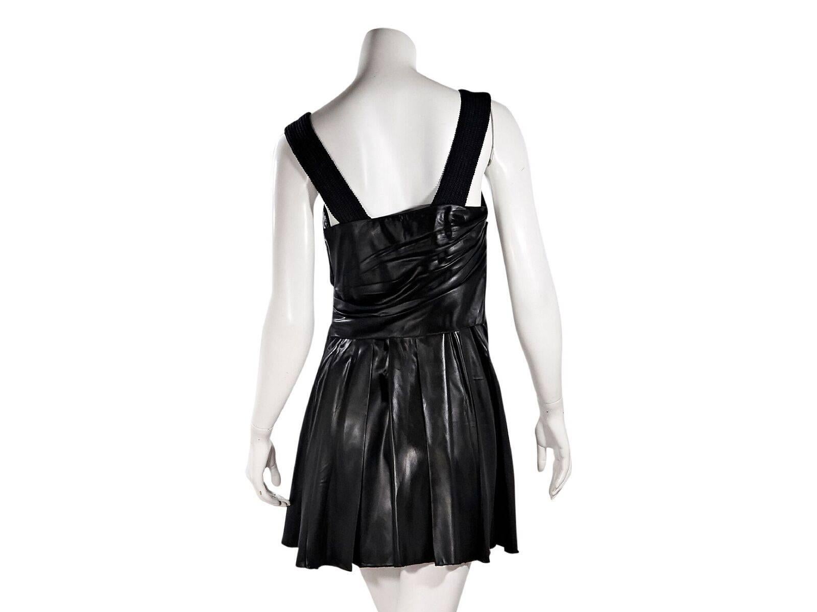 Product details:  Black pleated mini dress by Prada.  Squareneck.  Sleeveless.  Concealed side zip closure.  Label size IT 46.  32