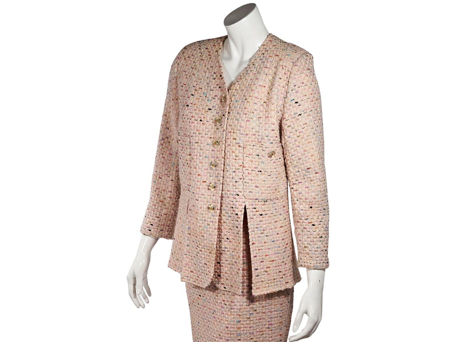 Product details:  Multicolor tweed skirt suit set by Chanel.  V-neck.  Long sleeves.  Button-front closure.  Chest button patch pockets.  Vented hem.  Matching pencil skirt.  Concealed back zip closure.  Goldtone hardware.  Jacket:  36