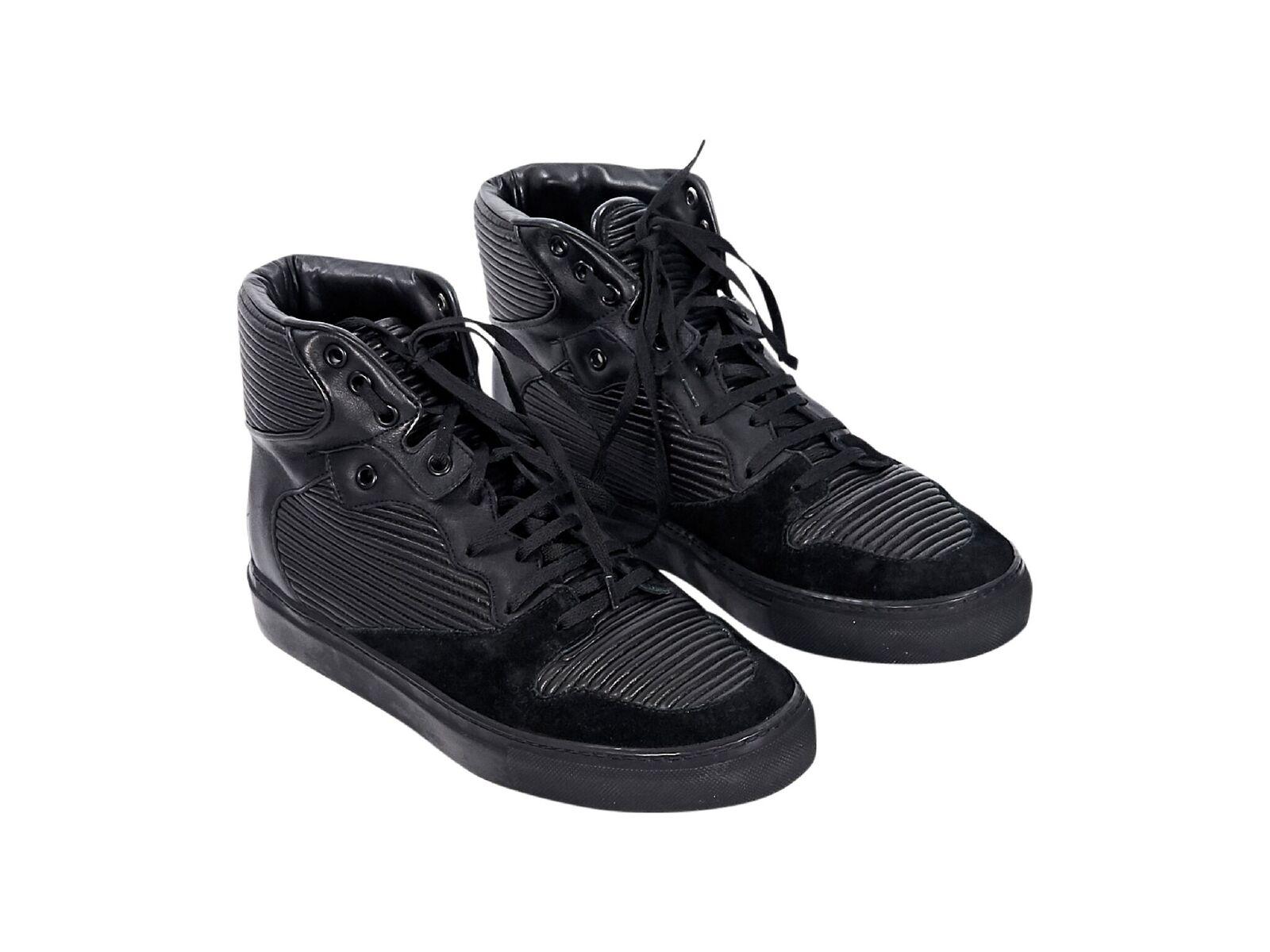 Product details:  Black ribbed leather high-top sneakers by Balenciaga.  Trimmed with suede.  Lace-up closure.  Round toe.  
Condition: Pre-owned. New with box.
Est. Retail $ 625.00