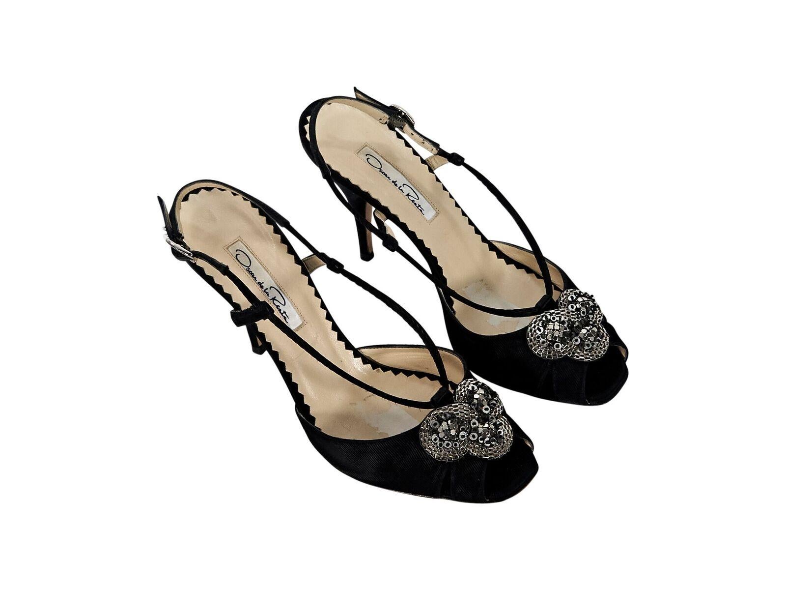 Product details:  Black textured evening sandals by Oscar de la Renta.  Adjustable slingback strap.  Embellished vamp design.  Peep toe.  EU size 37.5.  4