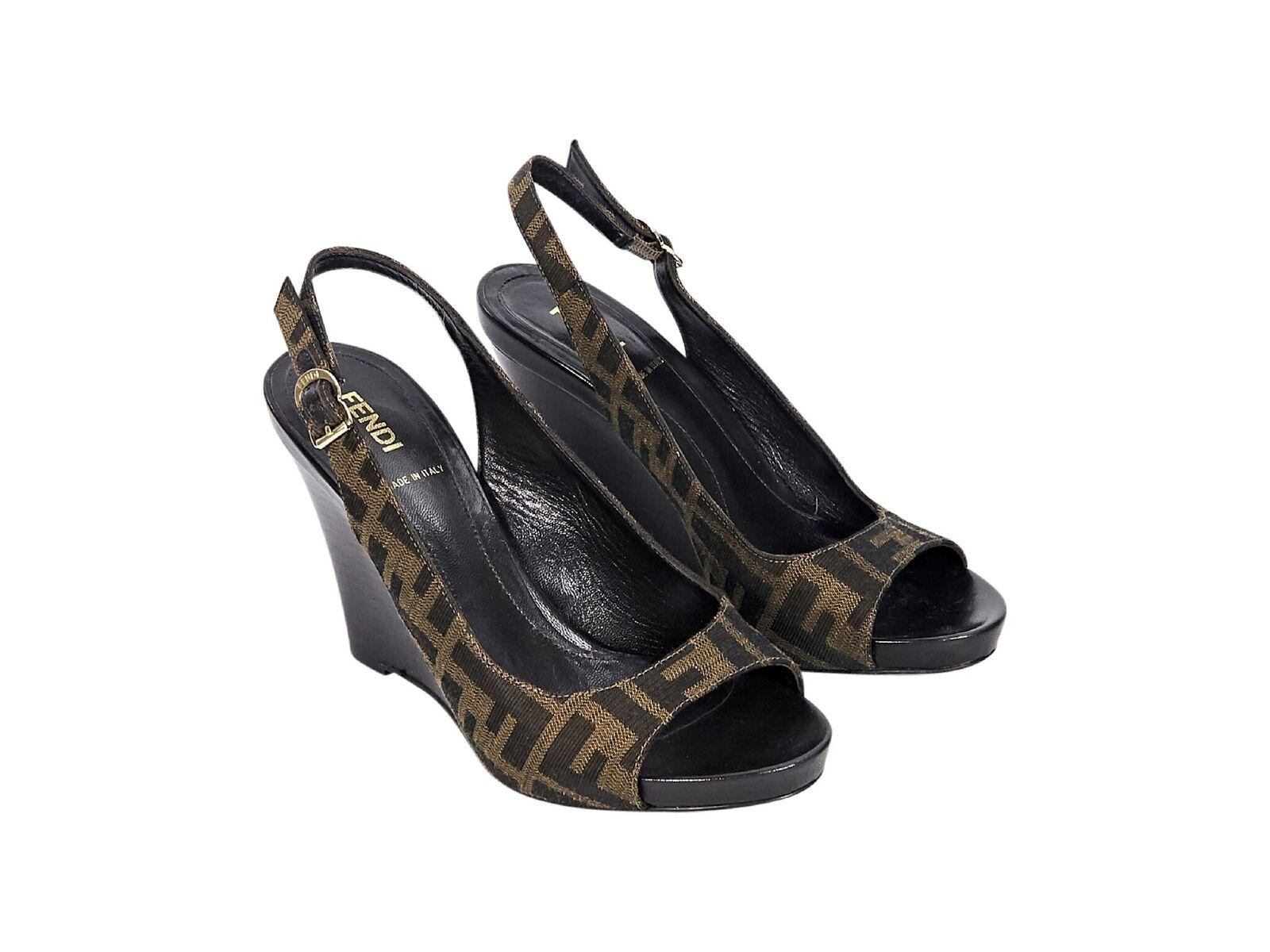 Product details:  Brown logo jacquard wedge sandals by Fendi.  Adjustable slingback strap.  Open toe.  Stacked wedge.  EU size 37.  3.5