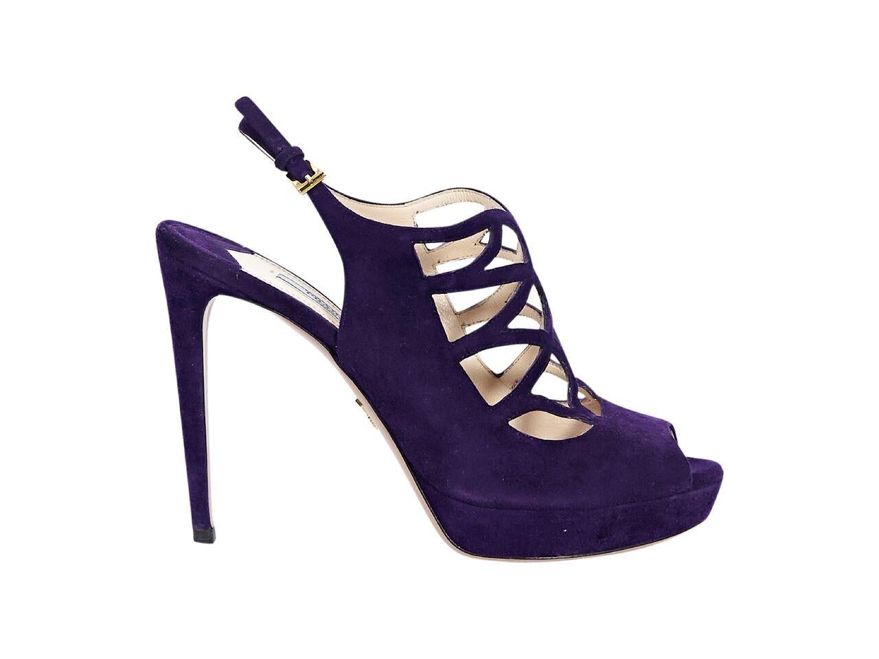 Product details:  Purple suede platform pumps by Prada.  Cutout design.  Adjustable slingback strap.  Peep toe.  5