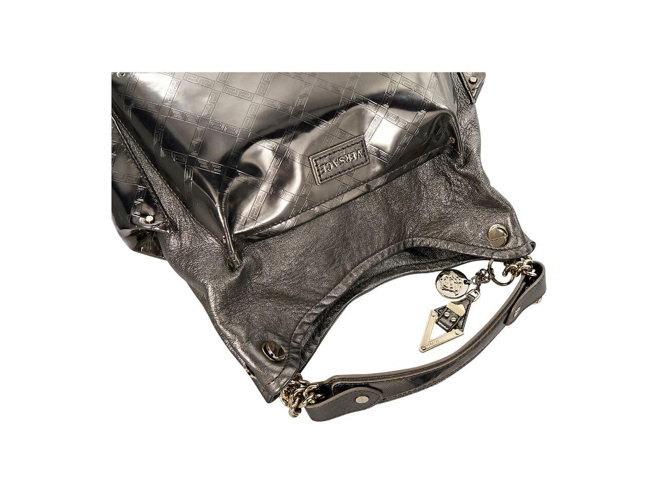Product details:  Metallic copper leather hobo bag by Versace.  Single shoulder strap.  Open top.  Lined interior with inner zip and slide pockets.  Goldtone hardware.  13