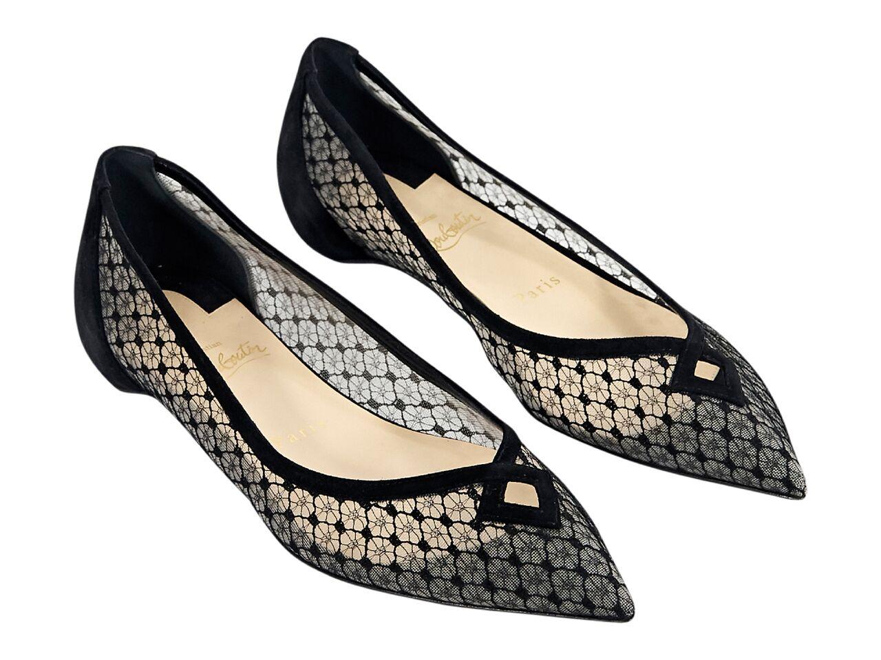 Product details:  Black mesh flats by Christian Louboutin.  Cutout detail at vamp.  Point toe.  Iconic red sole.  Slip-on style. 
Condition: Pre-owned. Very good. 
Est. Retail $ 995.00