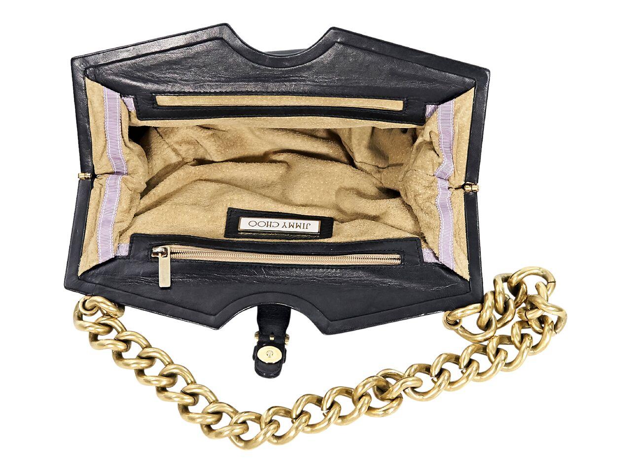 Product details:  Black leather shoulder bag by Jimmy Choo.  Accented with pleats.  Single chain shoulder strap.  Top magnetic snap tab closure.  Lined interior with inner zip and slide pockets.  Goldtone hardware.  
Condition: Pre-owned. Very good.