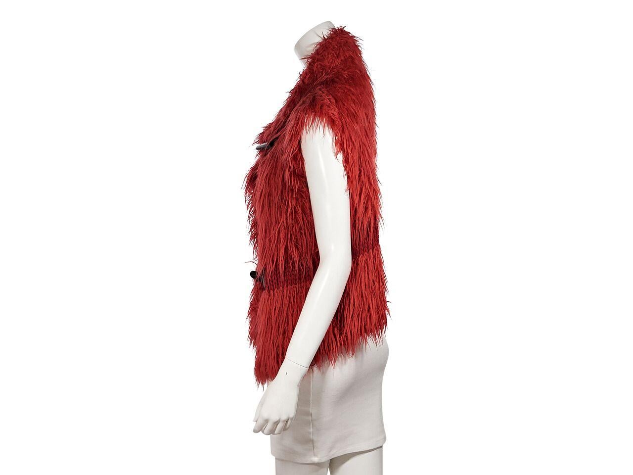 Product details:  Orange mohair vest by Issey Miyake.  Shawl collar.  Sleeveless.  Wooden ox horn clasp closures.  36