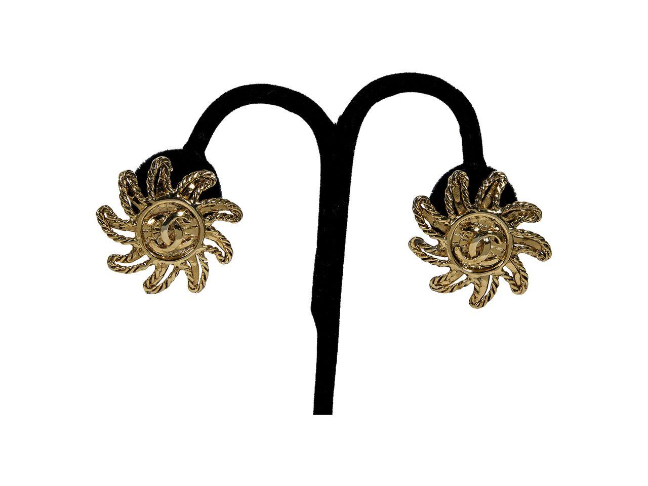 Product details:  Vintage goldtone starburst earrings by Chanel.  Clip-on backing.  1.5