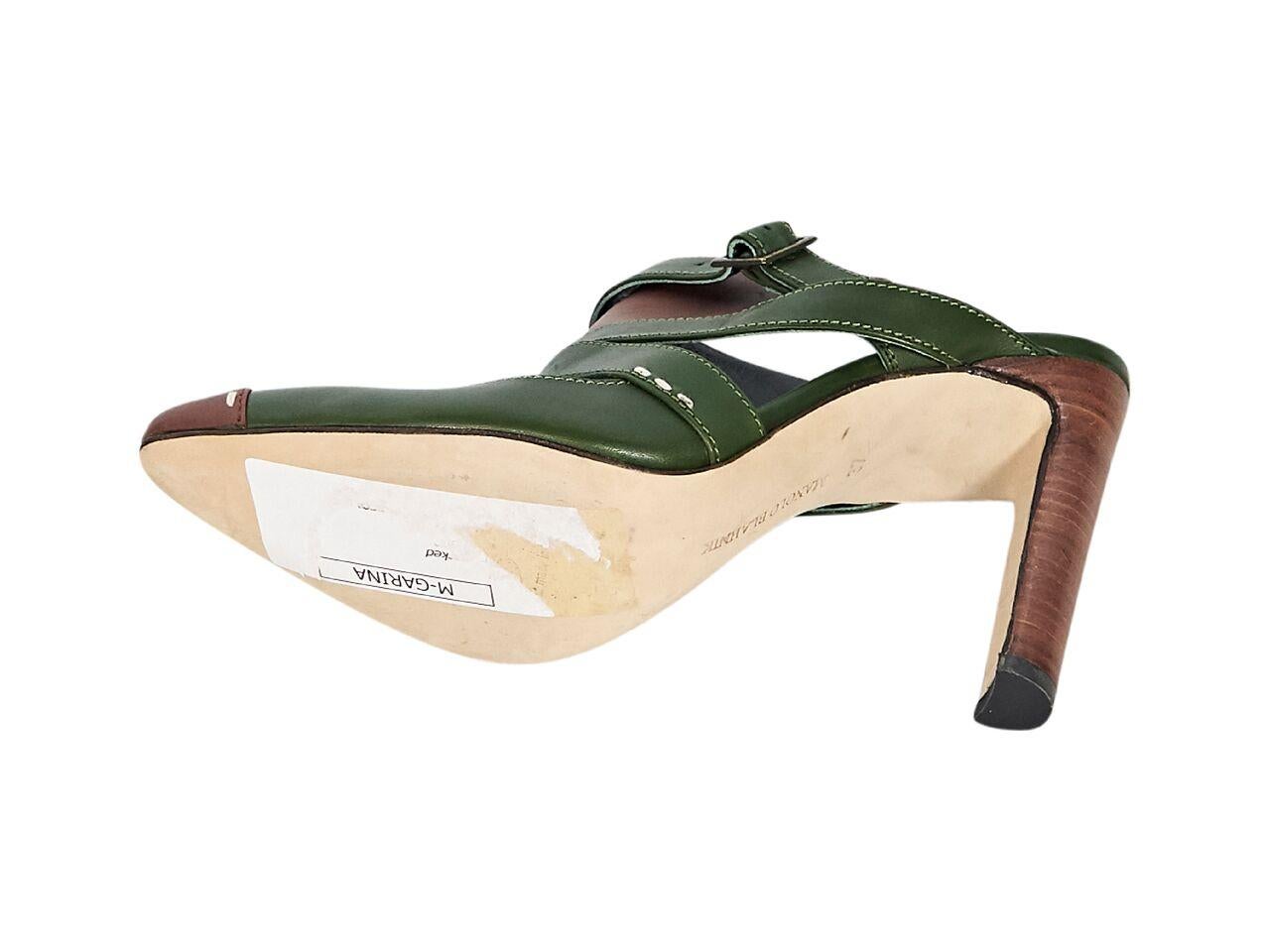 Product details:  Green and brown strappy leather mules by Manolo Blahnik.  Round toe.  Stacked heel.  Slip-on style.  4