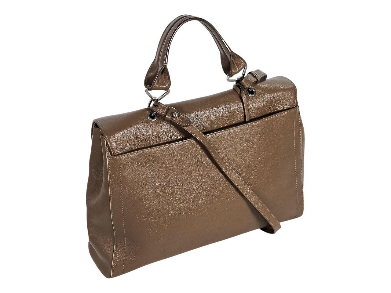 Product details:  Brown leather satchel by Marc Jacobs.  Top carry handle.  Detachable, adjustable shoulder strap.  Front flap with push-lock closure.  Lined interior with inner zip and slide pockets.  Side snap gussets.  Back exterior slide pocket.