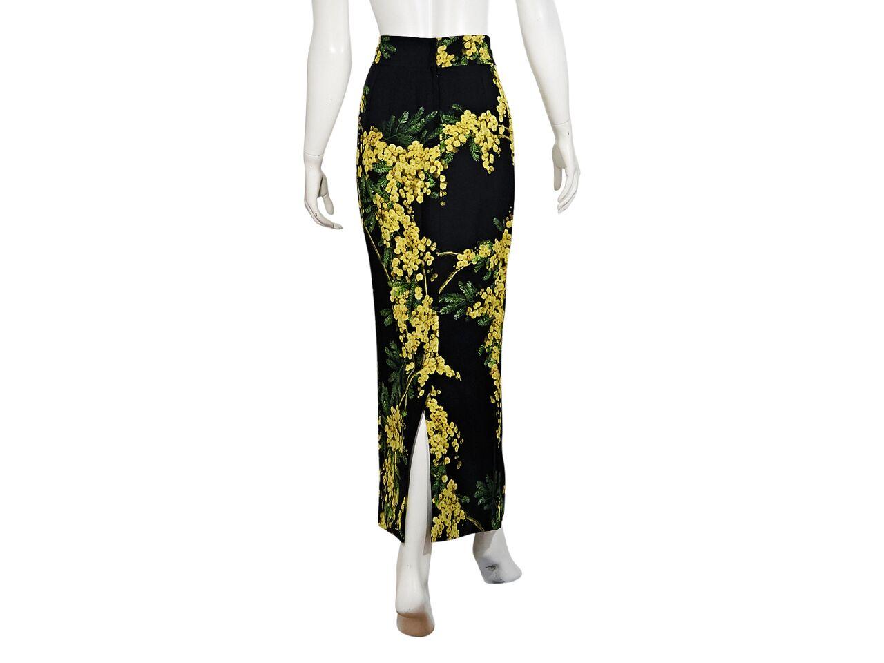 Product details:  Black and yellow floral-printed maxi skirt by Dolce & Gabbana.  Wide banded waist.  Back center hem vent.  31