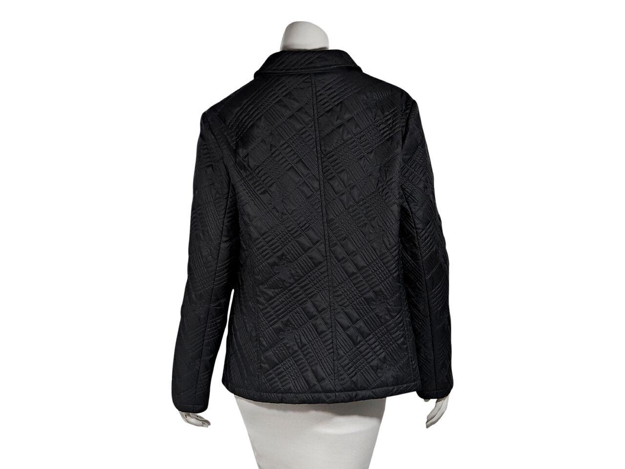 Product details:  Dark grey lightweight quilted jacket by Burberry London.  Spread collar.  Long sleeves.  Zip-front closure.  Waist on-seam slide pockets.  41