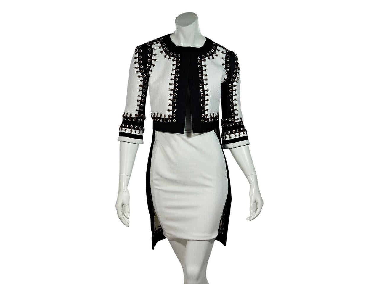 Product details:  Black and white cropped-front jacket  by Givenchy.  Paneled design accented with grommets.  Split jewelneck.  Elbow-length sleeves.  Open front.  35