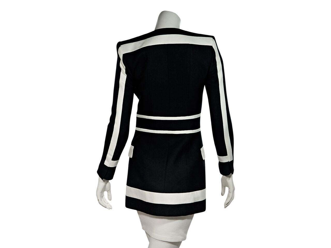 Product details:  Black and white striped fitted blazer by Balmain.  Deep v-neckline.  Bracelet-length sleeves.  Concealed hook-front closure.  Waist flap pockets.  Label size FR 36.  32.5