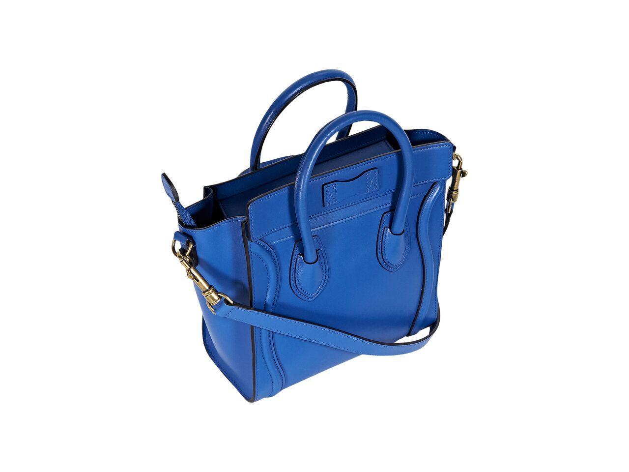 Product details:  Blue leather nano luggage satchel by Celine.  Dual carry handles.  Detachable crossbody strap.  Top zip closure.  Leather lined interior with inner slide pocket.  Front exterior zip pocket.  Goldtone hardware.  
Condition: